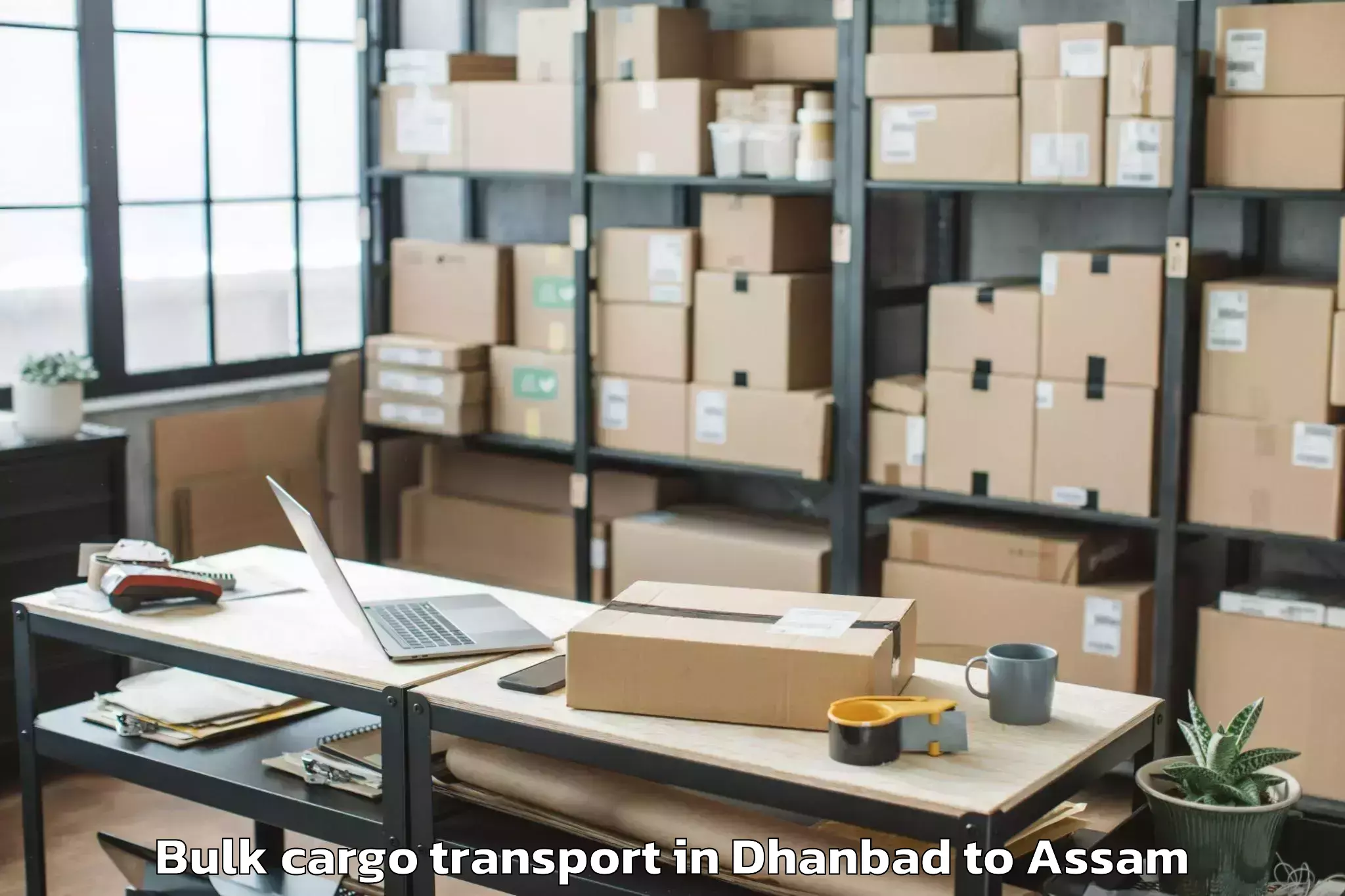 Book Your Dhanbad to Kharupetia Bulk Cargo Transport Today